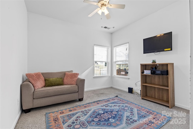 sitting room featuring visible vents, carpet flooring, a ceiling fan, and baseboards