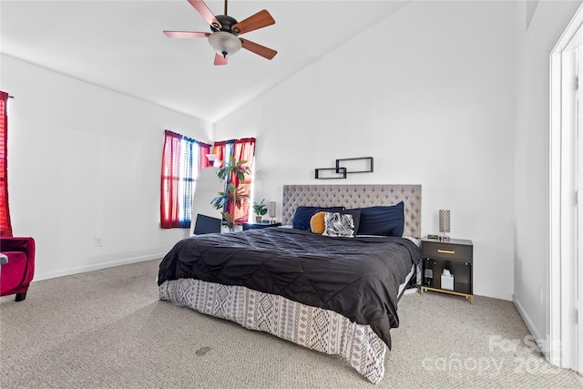 carpeted bedroom with lofted ceiling, a ceiling fan, and baseboards