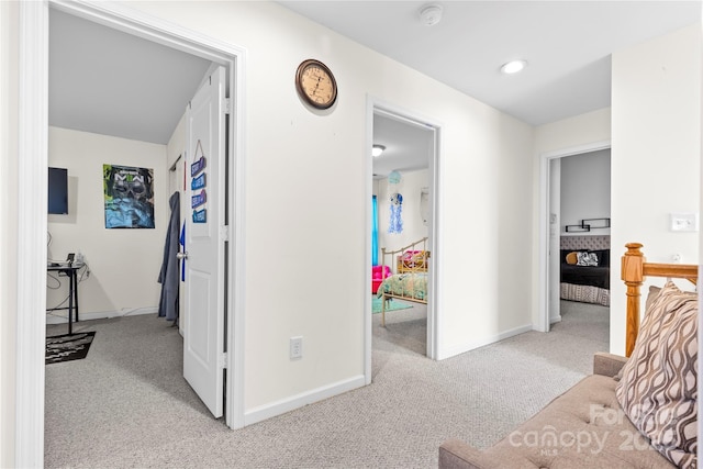 corridor with carpet, baseboards, and recessed lighting