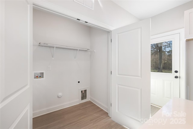 laundry area with washer hookup, laundry area, light wood-style flooring, hookup for a gas dryer, and electric dryer hookup