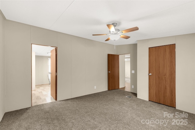 unfurnished bedroom with a ceiling fan, carpet floors, and a closet