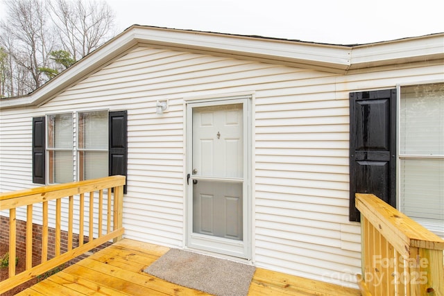 entrance to property with a wooden deck