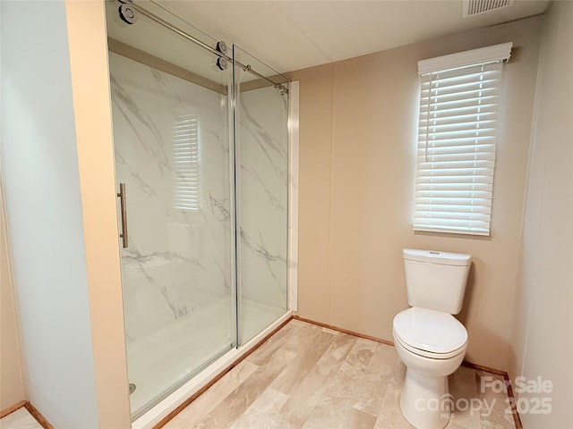 full bath with toilet, a marble finish shower, and visible vents