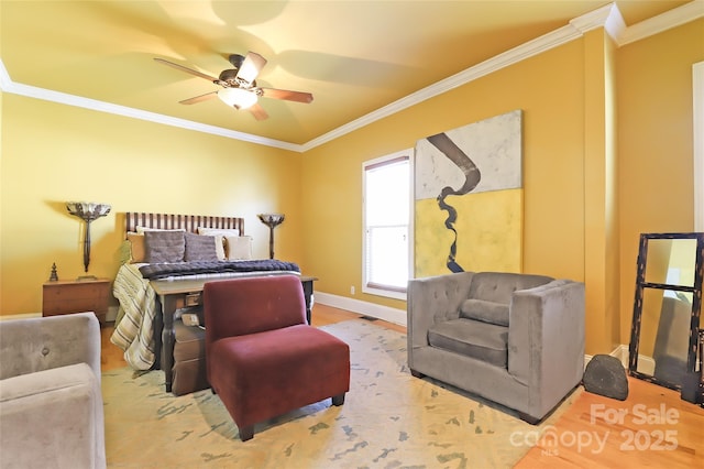 bedroom with baseboards, ornamental molding, and ceiling fan