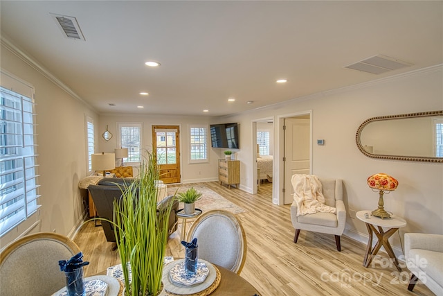 interior space with recessed lighting, visible vents, light wood-style flooring, ornamental molding, and baseboards