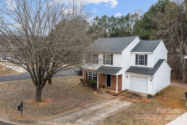 traditional-style home featuring concrete driveway, brick siding, a garage, and a shingled roof