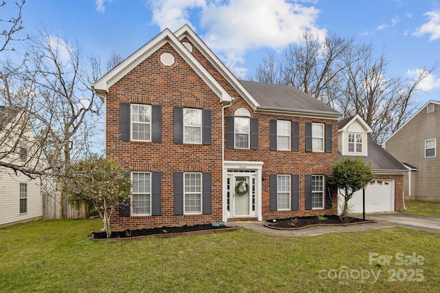 view of front of home with a garage, a front lawn, aphalt driveway, and brick siding