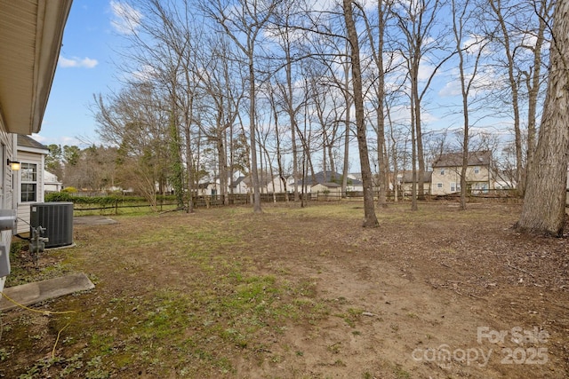 view of yard with fence and cooling unit