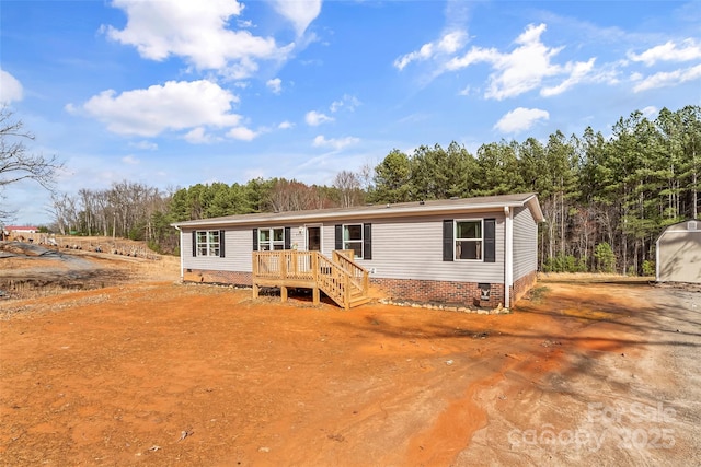 manufactured / mobile home featuring crawl space and a deck