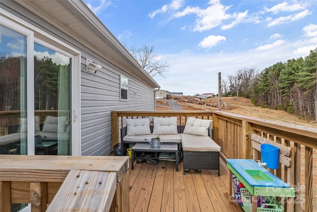 wooden deck with outdoor lounge area