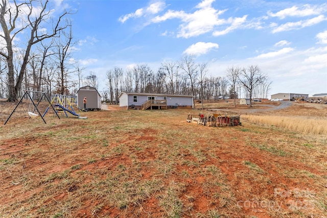 view of yard with an outdoor structure and a storage shed