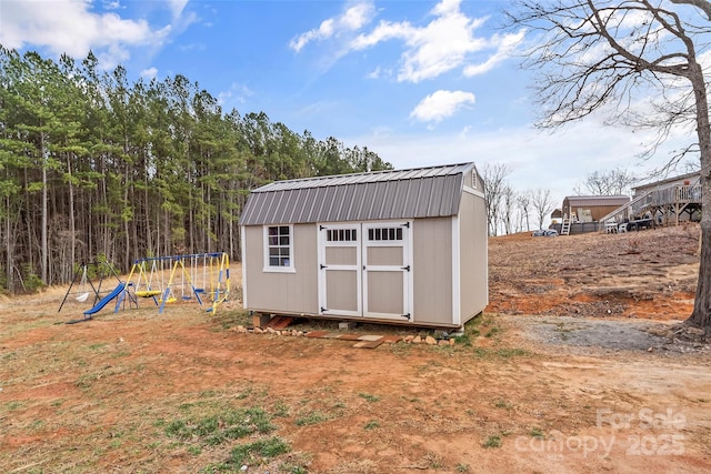 view of shed featuring a playground