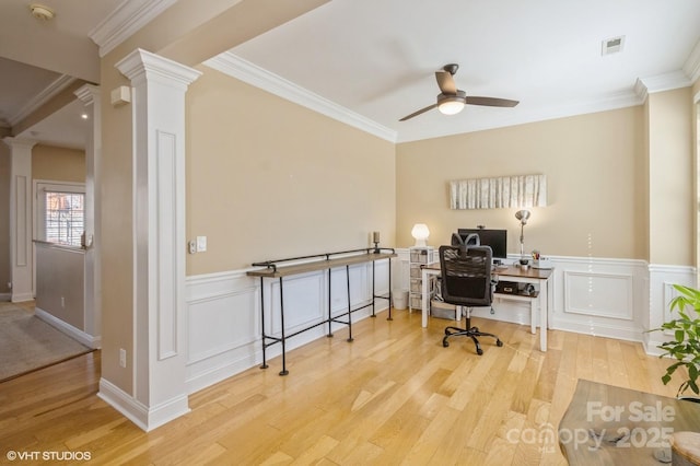 office area featuring ornamental molding, wood finished floors, decorative columns, and visible vents