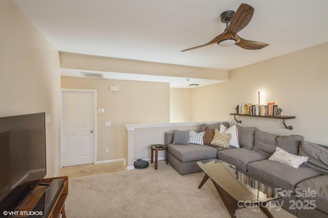 living area with ceiling fan, carpet, visible vents, and baseboards