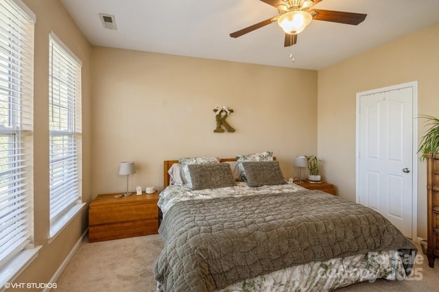 bedroom featuring ceiling fan, carpet floors, and visible vents