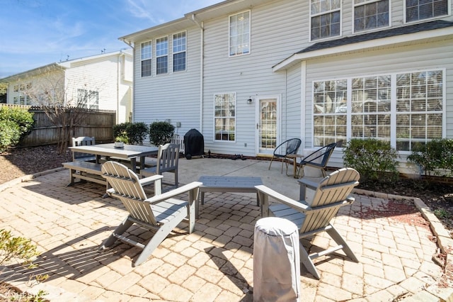 view of patio / terrace featuring fence and outdoor dining space