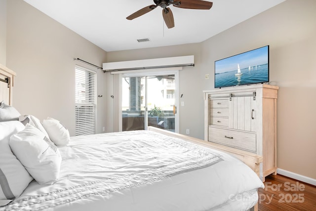 bedroom featuring visible vents, a ceiling fan, wood finished floors, access to outside, and baseboards