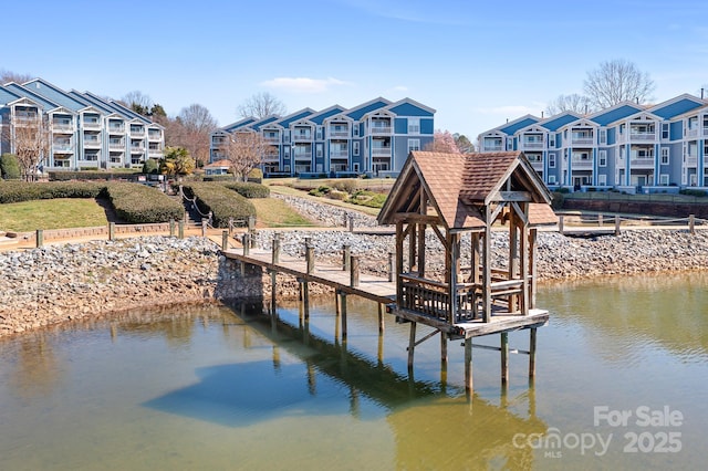 dock area featuring a water view