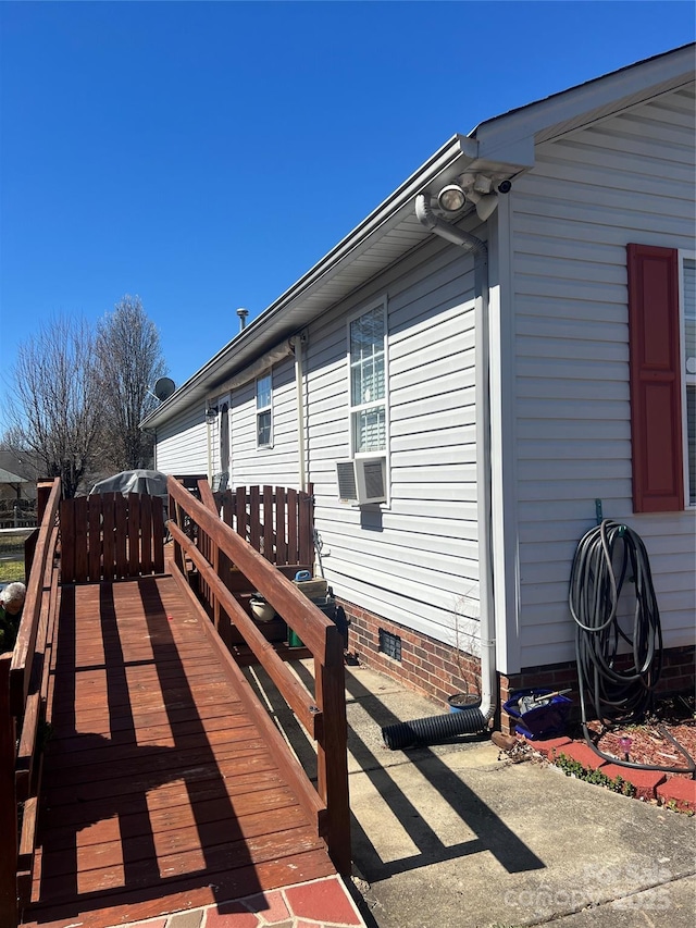 view of side of property featuring crawl space and cooling unit