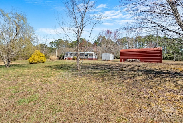 view of yard with a detached carport