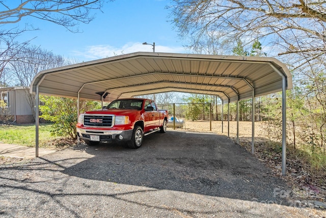 view of vehicle parking with a detached carport