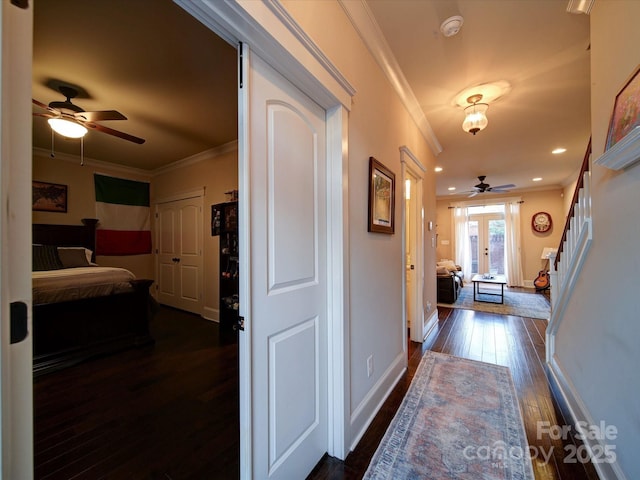 hall featuring dark wood-style floors, french doors, crown molding, stairway, and baseboards