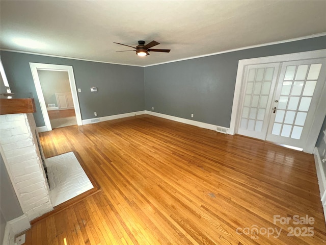 unfurnished living room with hardwood / wood-style flooring, ceiling fan, and crown molding