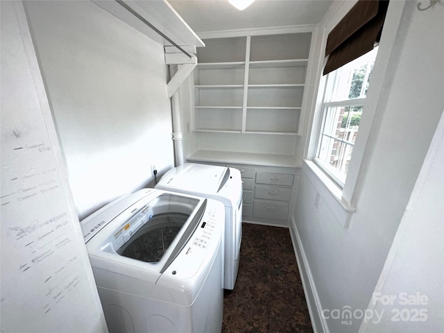 laundry room featuring washer and dryer and laundry area