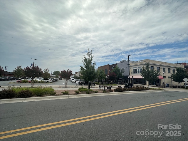 view of road featuring curbs and sidewalks