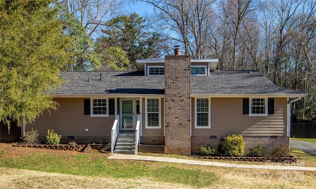 view of front of property featuring crawl space, entry steps, a chimney, and a shingled roof