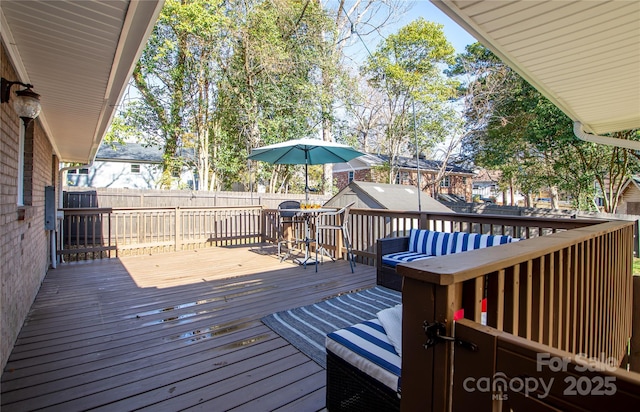 wooden deck featuring fence