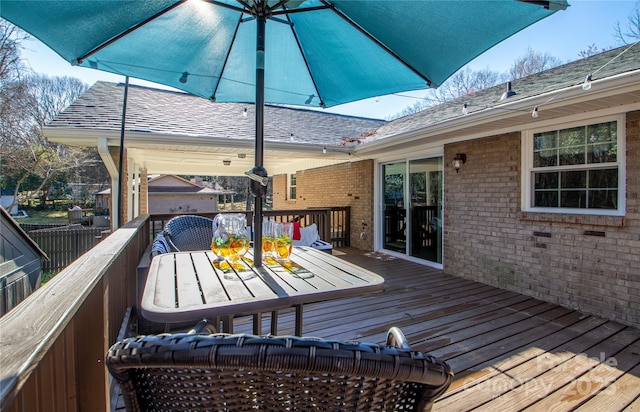 wooden deck with outdoor dining area