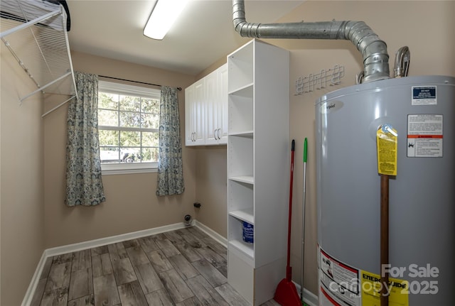 utility room featuring water heater