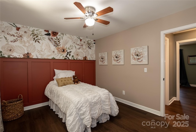 bedroom with dark wood finished floors, baseboards, and a ceiling fan