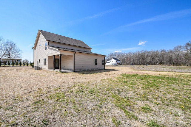 rear view of house with central AC