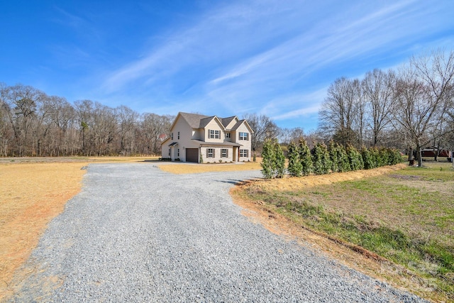 view of front of home with a garage and driveway