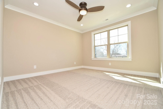 carpeted empty room with ornamental molding, recessed lighting, a ceiling fan, and baseboards