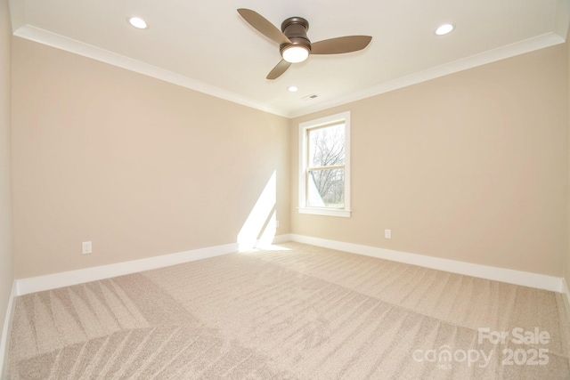 carpeted empty room with baseboards, recessed lighting, a ceiling fan, and crown molding