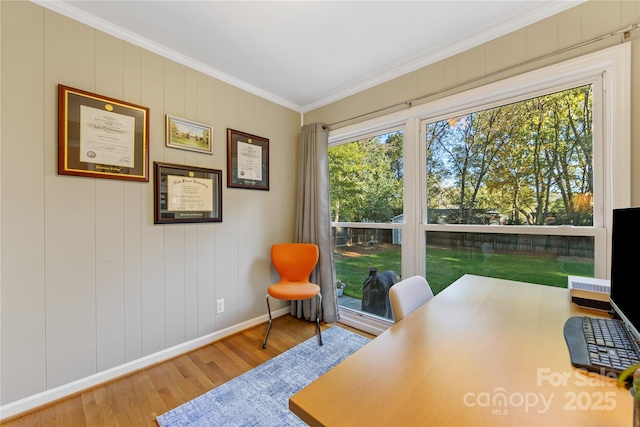 home office featuring baseboards, plenty of natural light, wood finished floors, and crown molding