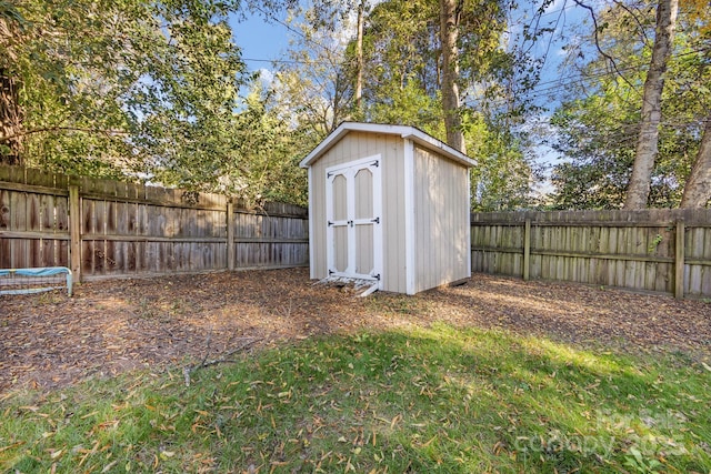 view of shed with a fenced backyard