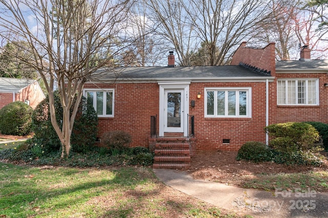 view of front facade featuring crawl space, brick siding, a chimney, and entry steps