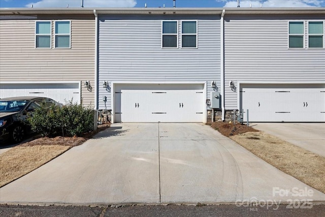 exterior space featuring concrete driveway