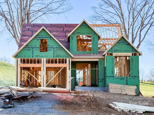 property in mid-construction featuring an outbuilding