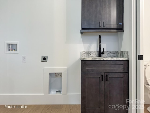 laundry area featuring washer hookup, cabinet space, and hookup for an electric dryer