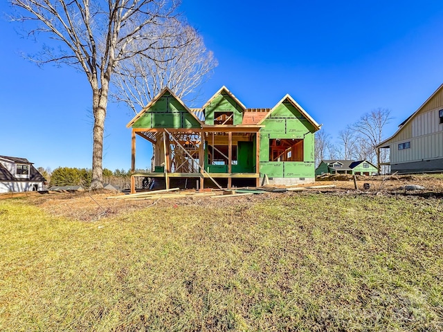 exterior space featuring an outbuilding, crawl space, and a lawn