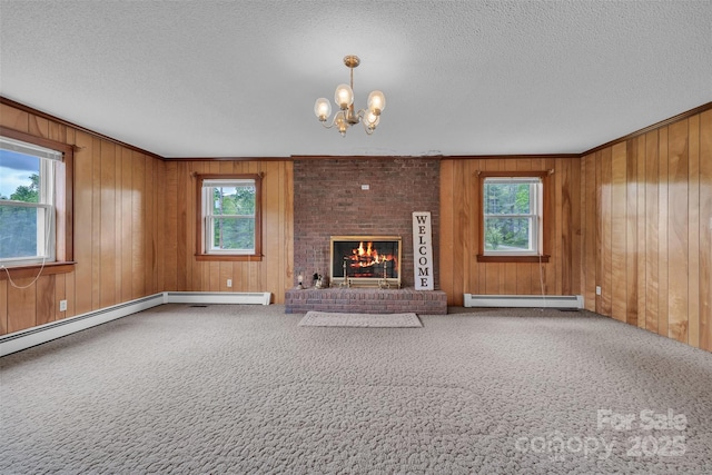 6285 NC-16 Hwy N, Taylorsville, NC 28681 - unfurnished living room featuring a textured ceiling, a chandelier, carpet, wood walls, and crown molding