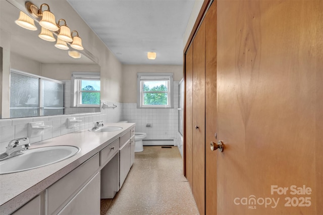 6285 NC-16 Hwy N, Taylorsville, NC 28681 - bathroom featuring a baseboard heating unit, tile walls, toilet, a shower with door, and wainscoting