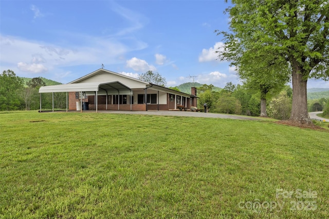 6285 NC-16 Hwy N, Taylorsville, NC 28681 - rear view of house with a lawn, brick siding, and a chimney