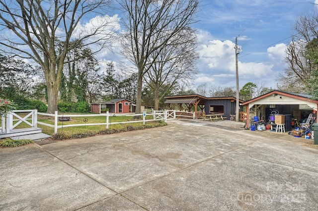 view of yard with an outbuilding and a fenced front yard