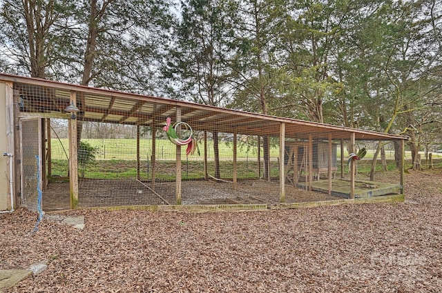 view of property's community with exterior structure, a carport, and an outbuilding